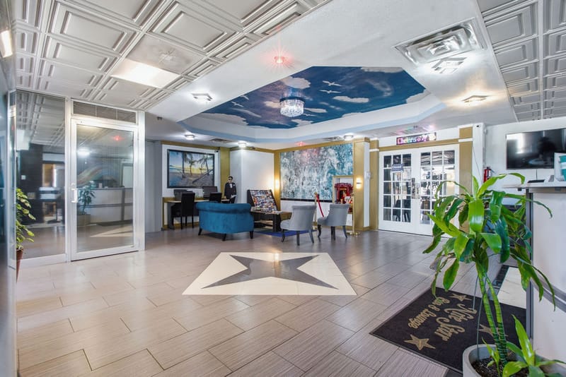 R Nite Star lobby with star-inlay tile floor and front desk