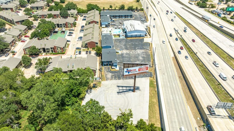 Aerial view of R Nite Star Hotel & Lounge beside the SH 360 frontage in Arlington