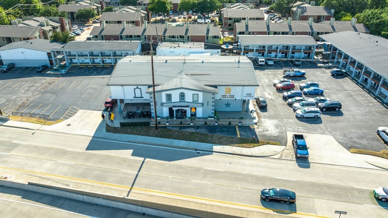 Aerial view of the hotel entrance and front parking